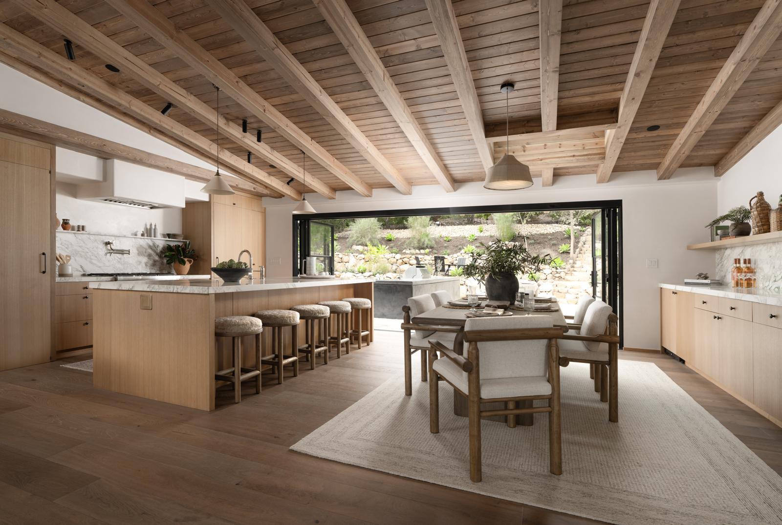 Professional home cleaner organizing a luxury Santa Barbara kitchen